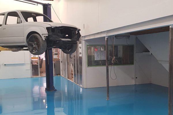 Mechanics workshop with epoxy coated concrete floor
